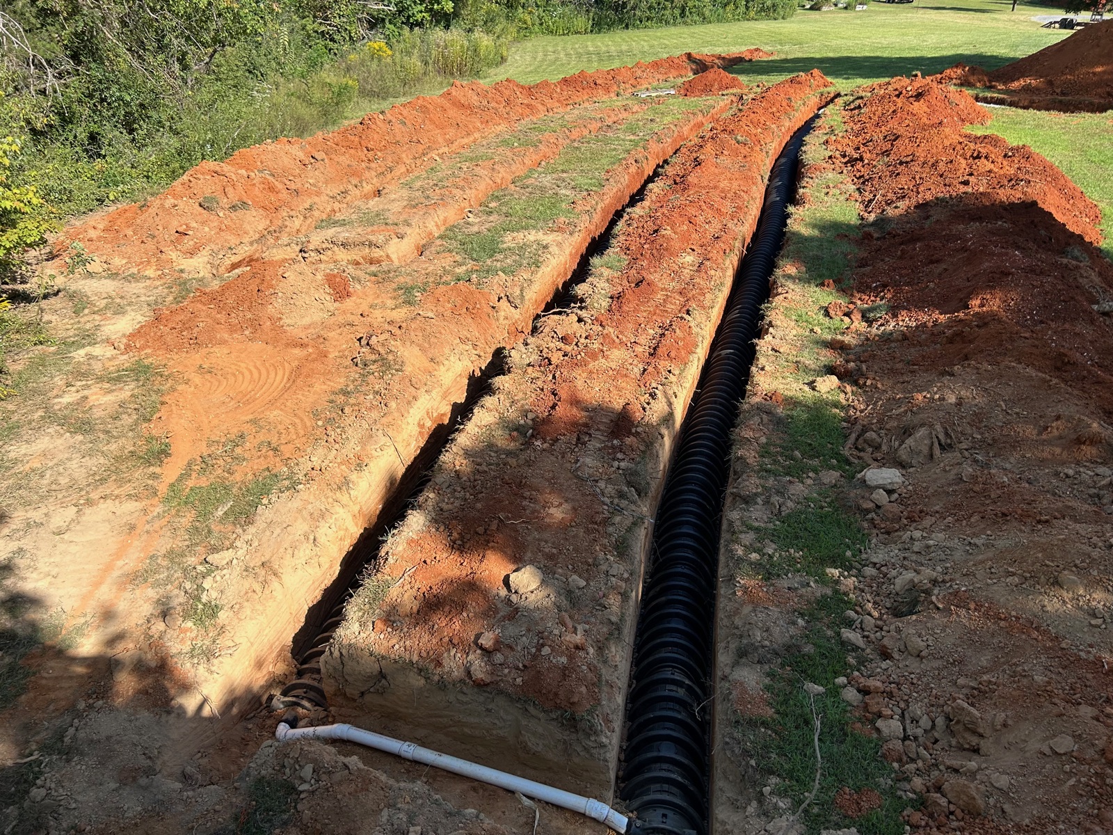 Septic drain field lines installed in fresh trenches