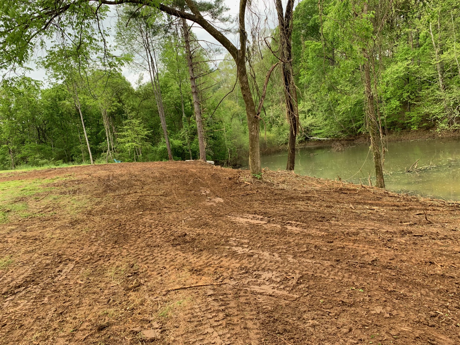 Riverbank lot freshly cleared and ready for construction