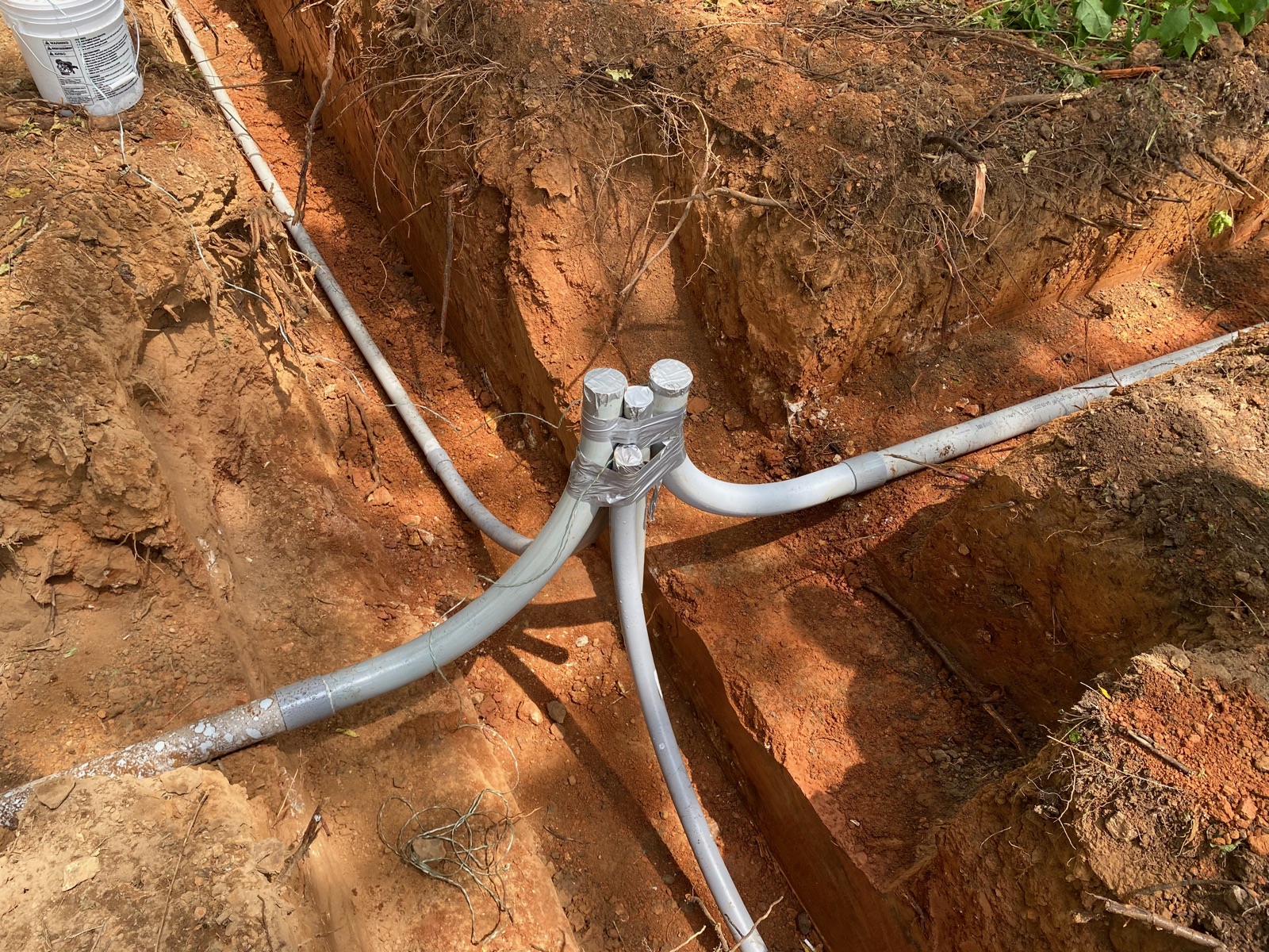 Utility distribution junction with multiple conduits feeding in