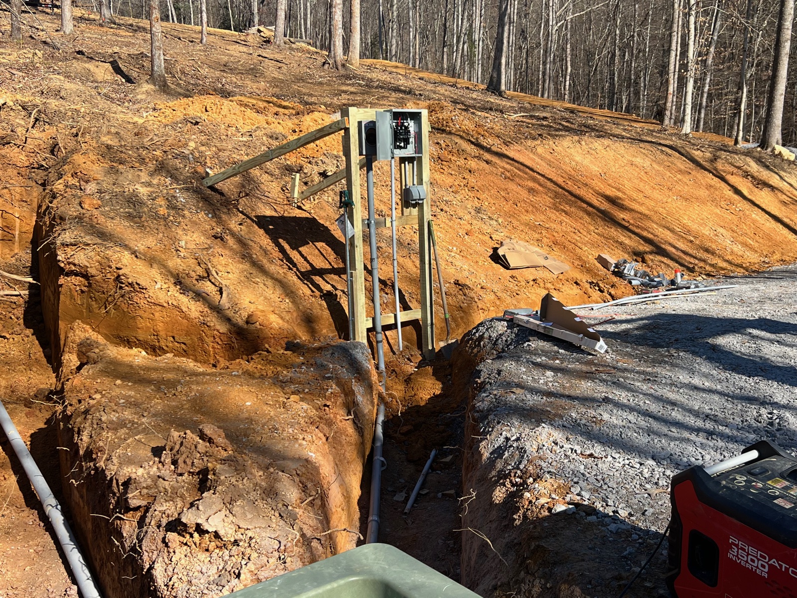 Septic system trench and distribution box on a finished site