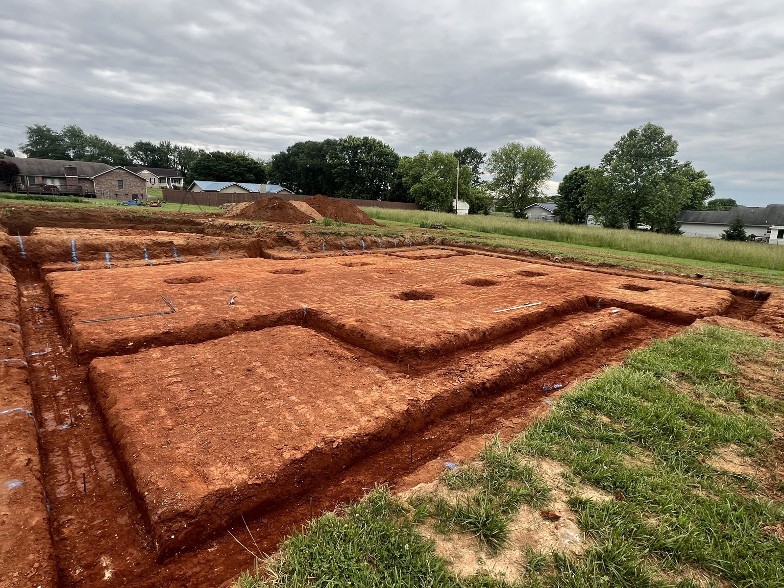 Excavated foundation footers on a residential lot