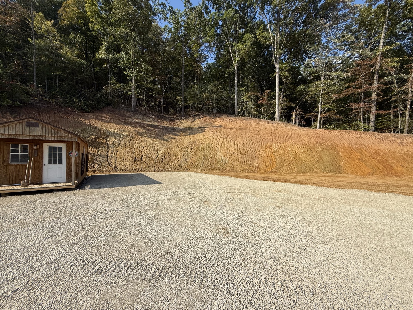 Cleared and graded lot with finished gravel pad