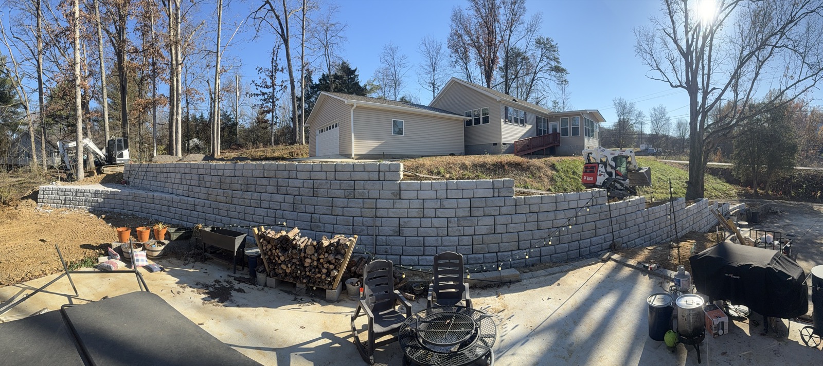 Finished block retaining wall behind a residential property