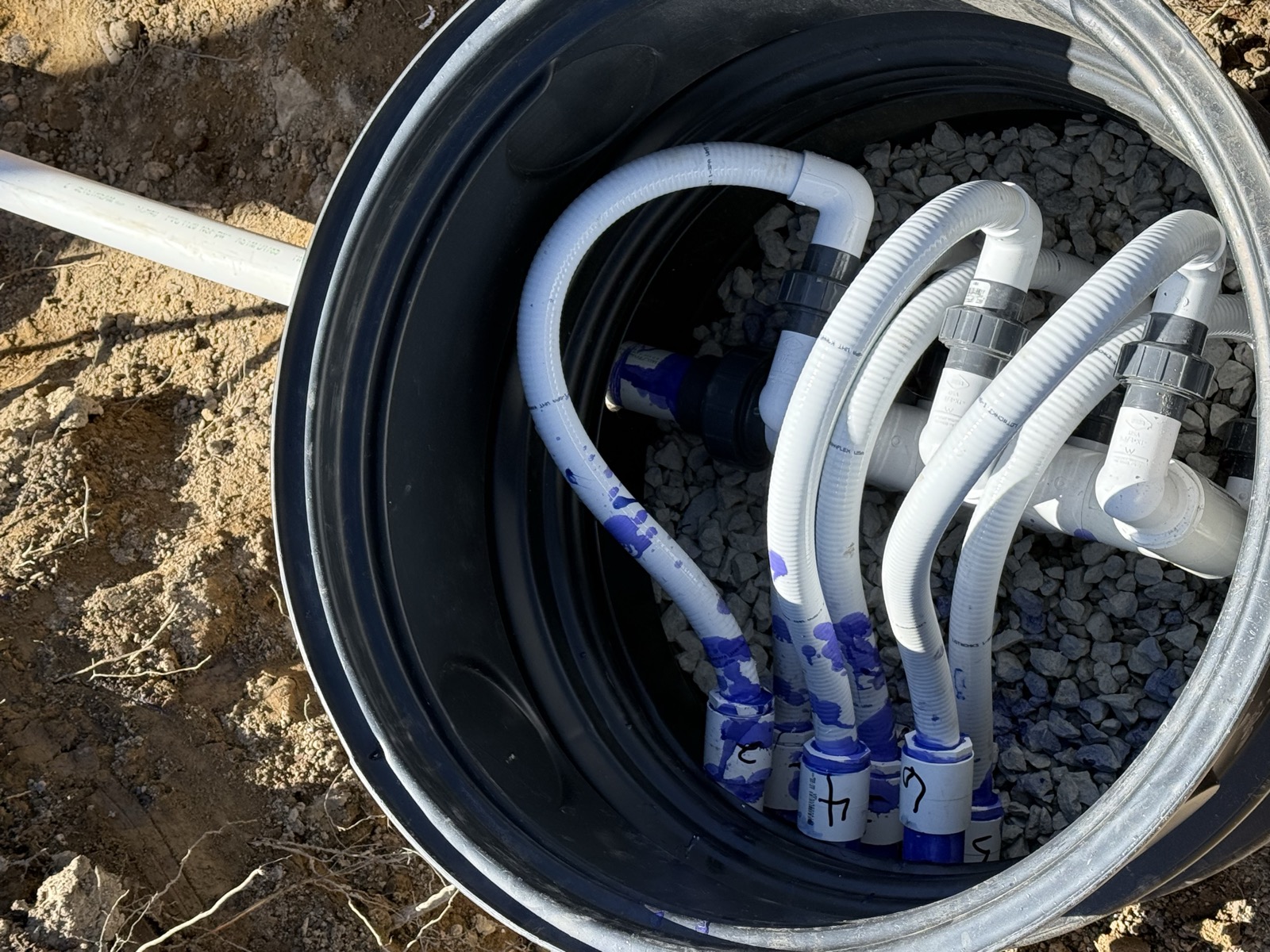 Septic distribution box plumbed and ready for backfill