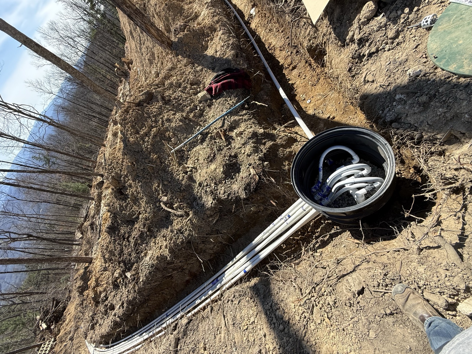 Septic line trenching with distribution box installed
