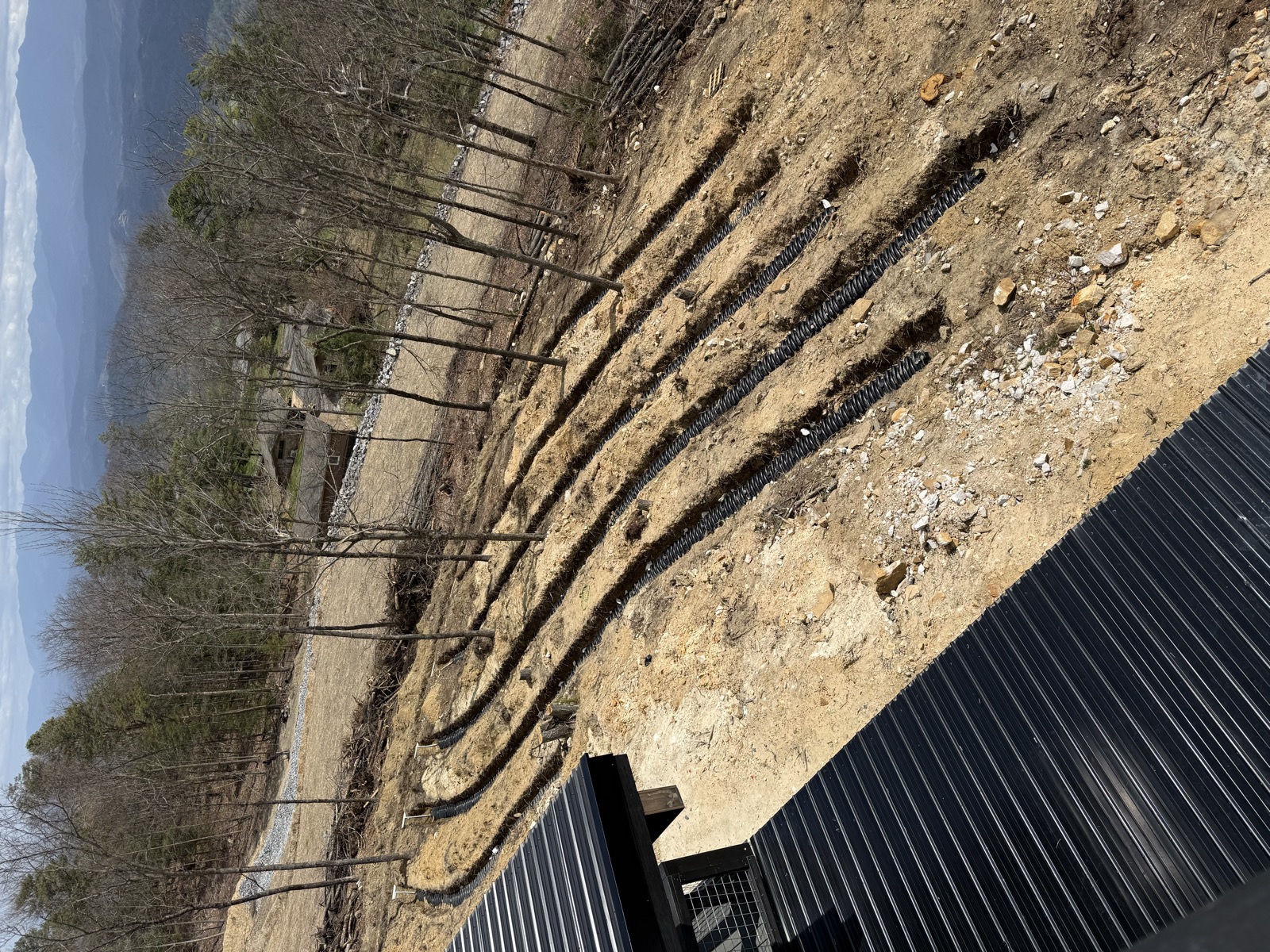 Newly installed septic field lines covered with gravel