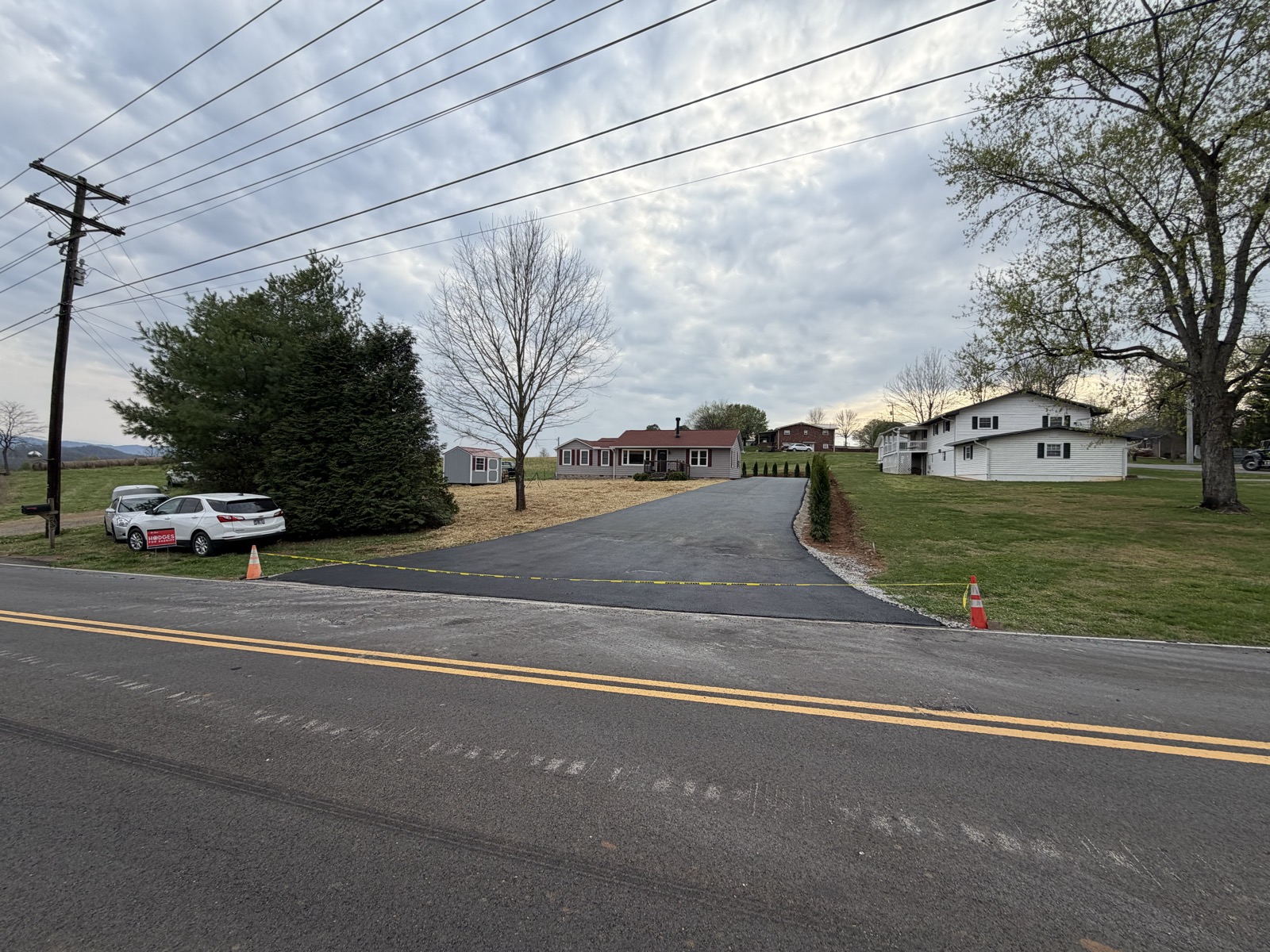 Asphalt driveway entrance and grade work